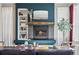 Bright living room with fireplace, built-in shelving, and natural light from the windows at 8846 Yates Dr, Westminster, CO 80031