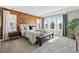 Bright main bedroom with a decorative accent wall, large windows, and tray ceiling at 8846 Yates Dr, Westminster, CO 80031