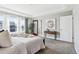 Spacious bedroom featuring a barn door leading to the bathroom and great natural light at 8846 Yates Dr, Westminster, CO 80031