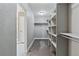 A spacious walk-in closet providing ample shelving and storage space at 8846 Yates Dr, Westminster, CO 80031