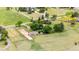 Overhead view of horse property with barn, paddock, open pasture and mature trees at 7583 W Trail South Dr, Littleton, CO 80125