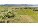 Breathtaking aerial view of a property with rolling hills and views of the city and mountains in the distance at 7583 W Trail South Dr, Littleton, CO 80125