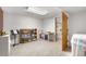 Unfinished basement with an access door, shelves and good lighting at 7583 W Trail South Dr, Littleton, CO 80125