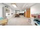 Large finished basement with recessed lights, carpet and games for entertainment at 7583 W Trail South Dr, Littleton, CO 80125