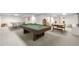 Finished basement with ping pong table, pool table, and foosball table for Gathering entertainment at 7583 W Trail South Dr, Littleton, CO 80125