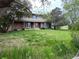 Traditional two-story brick house with bright windows and a sprawling lawn at 7583 W Trail South Dr, Littleton, CO 80125