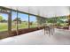 Enclosed outdoor patio with brick accents and scenic views of the property and surrounding landscape at 7583 W Trail South Dr, Littleton, CO 80125