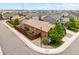 Back view of home with a deck and fenced yard, nestled in a well-kept neighborhood with mature trees at 1836 Taos St, Brighton, CO 80603