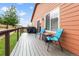 Inviting back deck featuring a grill and cozy seating, perfect for outdoor relaxation and entertaining at 1836 Taos St, Brighton, CO 80603