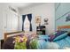 Bright bedroom featuring playful Paw Patrol bedding and decor and a lovely window at 1836 Taos St, Brighton, CO 80603