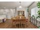 Inviting dining room features wood floors, a table with seating, and ample natural light at 1836 Taos St, Brighton, CO 80603