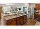 Modern kitchen with stainless steel appliances, ample countertop space, and a convenient breakfast bar at 1836 Taos St, Brighton, CO 80603