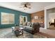 Comfortable living room with stylish seating, accent wall, and natural light at 1836 Taos St, Brighton, CO 80603