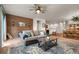 Open-concept living room seamlessly connects to the dining area, offering ample space and natural light at 1836 Taos St, Brighton, CO 80603