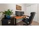 Well-lit home office featuring a desk with dual monitors and black drawers at 1836 Taos St, Brighton, CO 80603