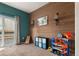 Versatile room perfect for a playroom or den, featuring wood accents and natural light at 1836 Taos St, Brighton, CO 80603