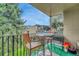 Small balcony with table and chairs, offering a tranquil view at 2231 S Vaughn Way # 305B, Aurora, CO 80014
