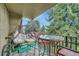 Relaxing balcony with seating, bicycle, and tree views at 2231 S Vaughn Way # 305B, Aurora, CO 80014