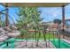 Private balcony with patio furniture and treetop views at 2231 S Vaughn Way # 305B, Aurora, CO 80014