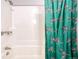 Bathroom with tub shower, and patterned shower curtain at 2231 S Vaughn Way # 305B, Aurora, CO 80014