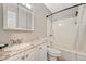 Clean bathroom with granite vanity, shower/tub combo, and updated fixtures at 2231 S Vaughn Way # 305B, Aurora, CO 80014