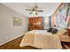 Main bedroom with world map and ceiling fan at 2231 S Vaughn Way # 305B, Aurora, CO 80014