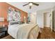 Main bedroom with ceiling fan and tapestry at 2231 S Vaughn Way # 305B, Aurora, CO 80014