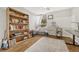 Bright bedroom with built-in shelving and a home office at 2231 S Vaughn Way # 305B, Aurora, CO 80014