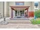 Condo building entrance with awning and seating at 2231 S Vaughn Way # 305B, Aurora, CO 80014