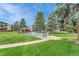 Inviting community pool, surrounded by a grassy lawn at 2231 S Vaughn Way # 305B, Aurora, CO 80014