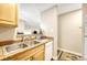 Kitchen with double sink and dishwasher at 2231 S Vaughn Way # 305B, Aurora, CO 80014