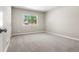 Bright bedroom with soft carpet and large window letting in plenty of natural light at 1179 Salem St, Aurora, CO 80011