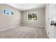 Comfortable bedroom featuring neutral tones, soft carpet, and a window that brings in outdoor light at 1179 Salem St, Aurora, CO 80011