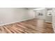 Bright living room features hardwood floors, a window for natural light, and fresh neutral paint at 1179 Salem St, Aurora, CO 80011