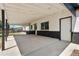 Covered outdoor patio space with a painted brick exterior and ample space for entertaining at 1179 Salem St, Aurora, CO 80011
