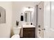 Bathroom featuring a vanity, toilet, and shower with curtain at 2986 S Elm St, Denver, CO 80222