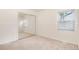Bedroom with carpet, window and closet with mirrored doors at 2986 S Elm St, Denver, CO 80222