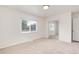 Bedroom with closet with sliding mirrored doors and window at 2986 S Elm St, Denver, CO 80222