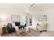Comfortable living room with neutral tones, plush seating, stylish decor, and access to the laundry at 2986 S Elm St, Denver, CO 80222