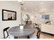 Open-concept living area with modern furnishings, wood floors, and lots of natural light at 2986 S Elm St, Denver, CO 80222
