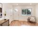 Bright living room features neutral walls, hardwood floors, and a view to the front yard at 2986 S Elm St, Denver, CO 80222