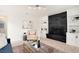 Inviting living room with a striking black brick fireplace and built-in shelving for stylish storage at 2986 S Elm St, Denver, CO 80222