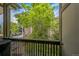 View from the balcony of lush, mature trees that provide shade and privacy at 1111 S Garrison St # 202, Lakewood, CO 80232