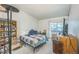 Bedroom with natural light with large window and basic furniture at 1111 S Garrison St # 202, Lakewood, CO 80232