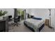 Bedroom with desk, carpet, and walk out to balcony at 1111 S Garrison St # 202, Lakewood, CO 80232