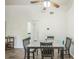 Dining area with wood floors features modern ceiling fan, and a dining table for four at 1111 S Garrison St # 202, Lakewood, CO 80232