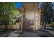 Two-story condo building with private entrance, wood siding, and mature trees around at 1111 S Garrison St # 202, Lakewood, CO 80232