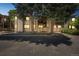 Inviting condominium complex featuring well-maintained grounds and mature trees at 1111 S Garrison St # 202, Lakewood, CO 80232