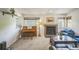 Bright living room boasting a brick fireplace, large window, and comfortable furnishings at 1111 S Garrison St # 202, Lakewood, CO 80232