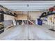 Attached garage with extra storage and overhead shelving at 2603 Reserve Ct, Erie, CO 80516